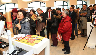 Stamp collectors wait to buy the Year of Rooster stamps in Toronto