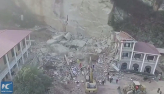 12 people die in central China landslide