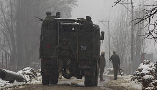Troops kill 2 militants in ongoing gunfight in Indian-controlled Kashmir