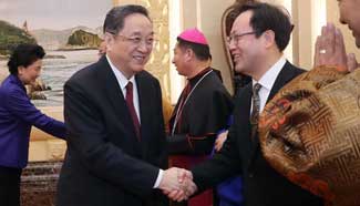 Top political advisor stresses CPC's leadership on religions