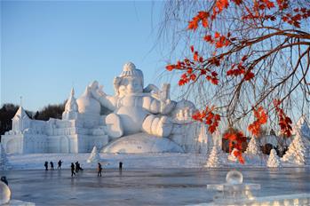 Tourists view snow sculptures in Harbin