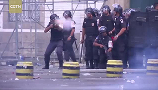 Protesters clash with police in Rio over financial crisis