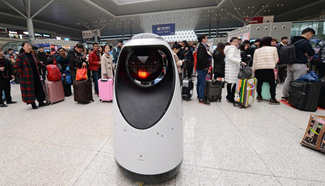 Robot patrols at railway station in C China's Henan