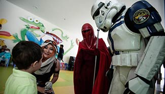 "Star Wars" figure dressed Colombians visit pediatric ward