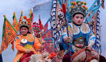 Children dressed as legendary figures parade on horseback in SE China