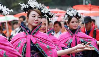 Women present Qipao in central China
