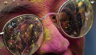 People take part in color run parade in Sao Paulo, Brazil