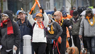 People participate in "Walk in Her Shoes" charity walk event in Vancouver