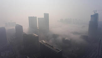 Fog shrouds buildings in Chengdu, southwest China