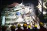 12月16日，救援人員在倒塌樓房現場搜救被困人員。新華社記者 崔新鈺 攝