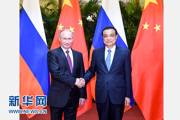 6月25日，國務院總理李克強在北京人民大會堂會見來華進行國事訪問的俄羅斯總統普京。 新華社記者 李學仁 攝