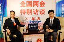 全國人大代表梁耀輝做客新華網、中國政府網設在大會堂的訪談間