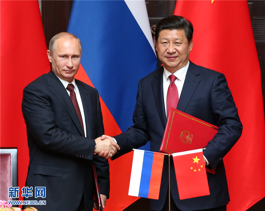 這是會談後，兩國元首共同簽署《中華人民共和國與俄羅斯聯邦關于全面戰略協作夥伴關係新階段的聯合聲明》。新華社記者 龐興雷 攝 