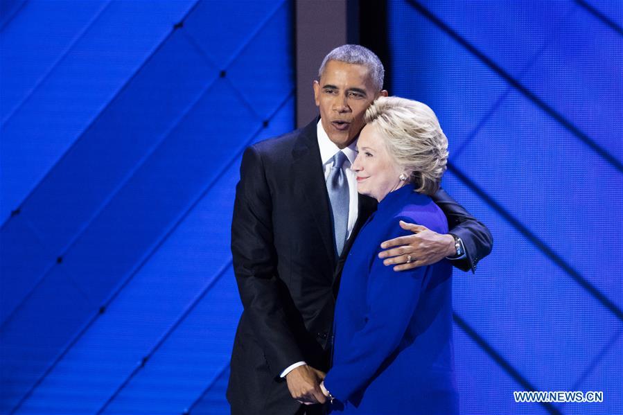 U.S. President Barack Obama (L) hugs U.S. Democratic Presidential Candidate Hillary Clinton on the third day of the 2016 U.S. Democratic National Convention, at Wells Fargo Center in Philadelphia, Pennsylvania, the United States, on July 27, 2016. U.S. President Barack Obama (L) hugs U.S. Democratic Presidential Candidate Hillary Clinton on the third day of the 2016 U.S. Democratic National Convention, at Wells Fargo Center in Philadelphia, Pennsylvania, the United States, on July 27, 2016.