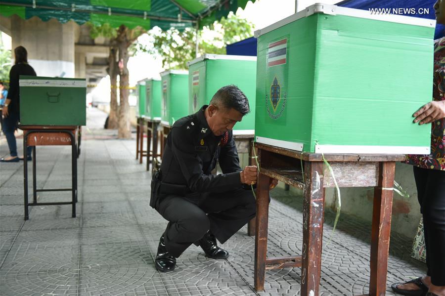 A police officer makes final preparation at a polling station in Bangkok, Aug. 7, 2016. A police officer makes final preparation at a polling station in Bangkok, Aug. 7, 2016.
