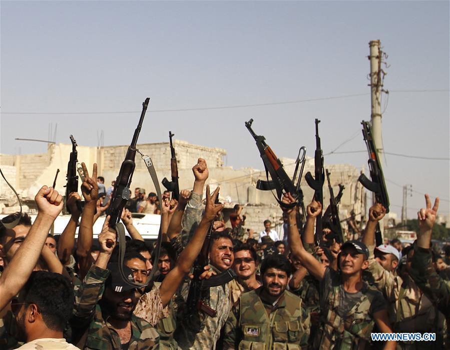 SYRIA-DARAYA-REBELS' EVACUATION-SYRIAN SOLDIERS-FEATURE