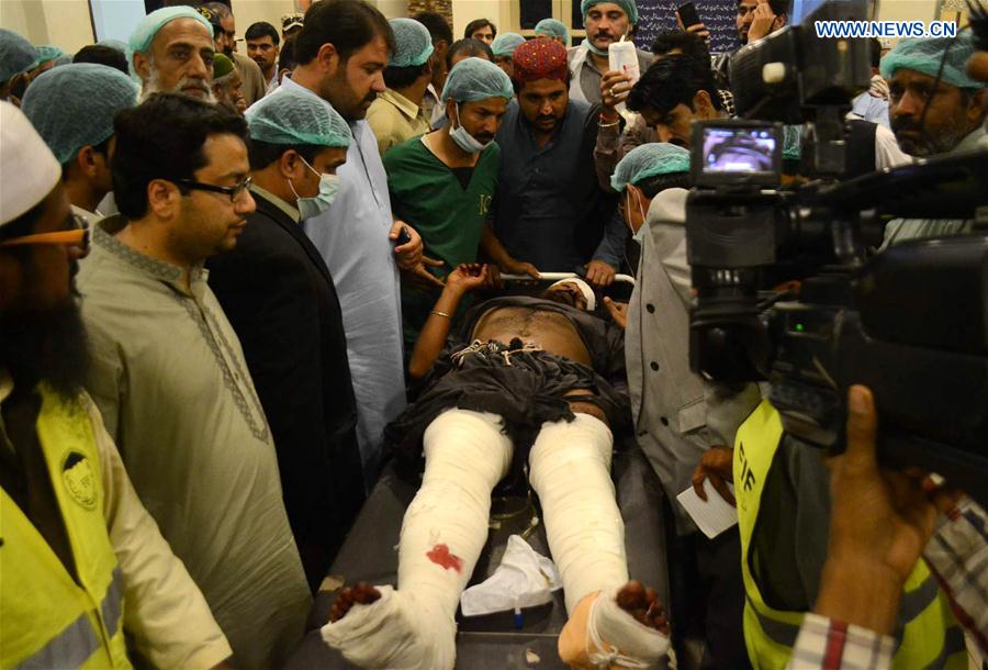 Rescuers transfer an injured man to a hospital in southern Pakistan's Hyderabad, on Feb. 16, 2017, following a suicide blast at a shrine in Sehwan town. Rescuers transfer an injured man to a hospital in southern Pakistan's Hyderabad, on Feb. 16, 2017, following a suicide blast at a shrine in Sehwan town.