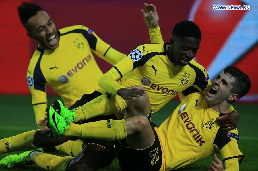 Christian Pulisic(R) of Dortmund celebrates scoring with his teammates during the UEFA Champions League Round of 16 second leg match between Borussia Dortmund and SL Benfica at Signal Iduna Park in Dortmund, Germany, on March 8, 2017.