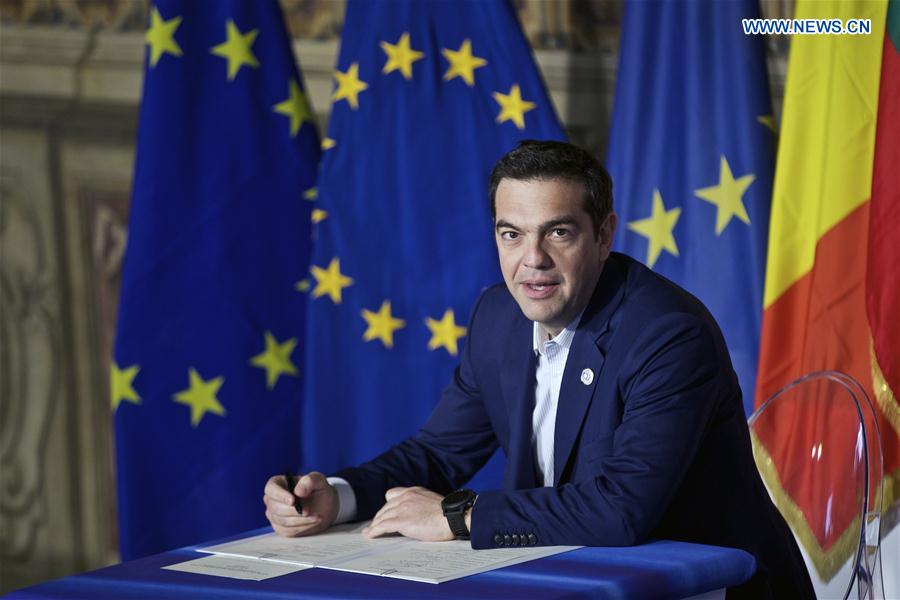 Greek Prime Minister Alexis Tsipras signs the 'Declaration of Rome' during a ceremony at Capitoline Hill in Rome, Italy, on March 25, 2017. 