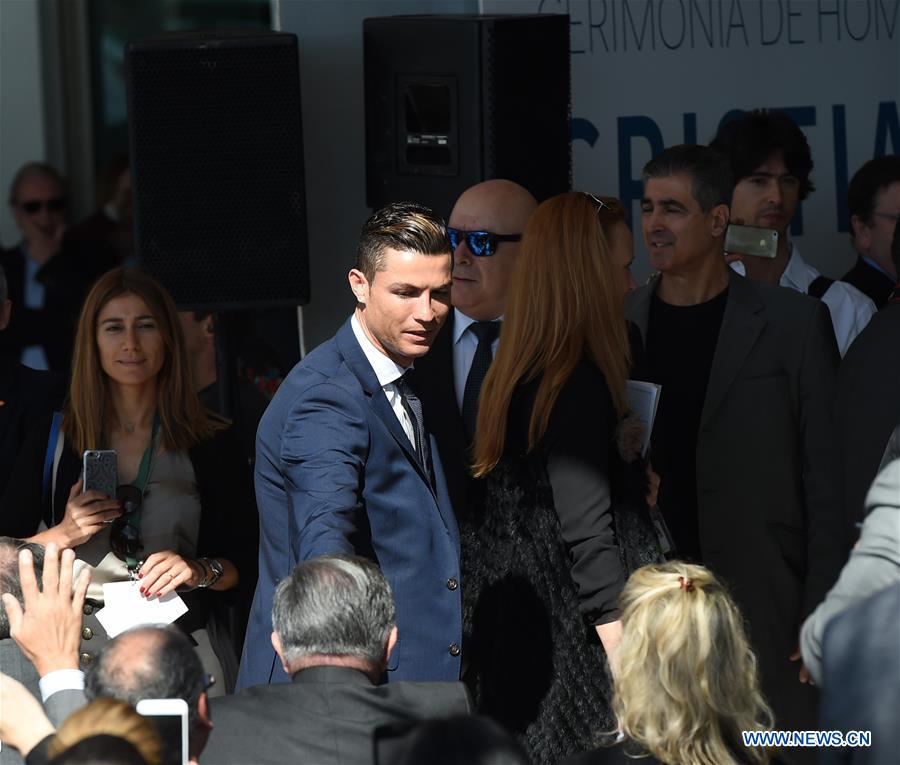 Portuguese footballer Cristiano Ronaldo (C) attends an airport renaming ceremony in Funchal March 29, 2017. Portugal on Wednesday renamed Madeira airport as Cristiano Ronaldo airport in honor of the captain of the Portuguese national football team. Funchal on Madeira Islands is the hometown of Cristiano Ronaldo. (Xinhua/Zhang Liyun) 