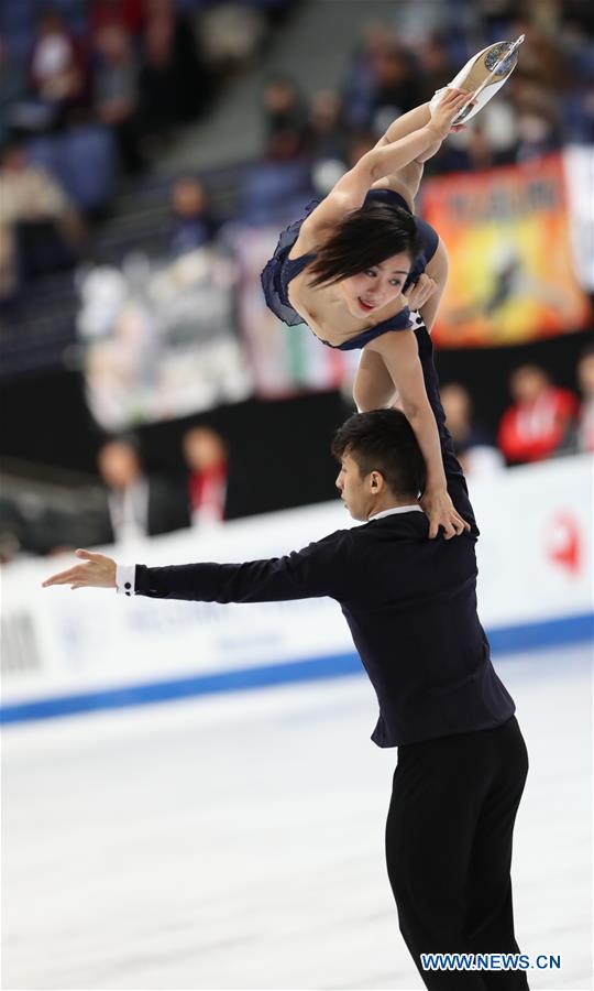 China's Sui Wenjing (Top) and Han Cong perform during the pairs short program of the ISU World Figure Skating Championships 2017 in Helsinki, Finland, on March 29, 2017. 