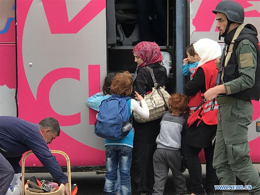 SYRIA-HOMS-LAST-REBELS-EVACUATION