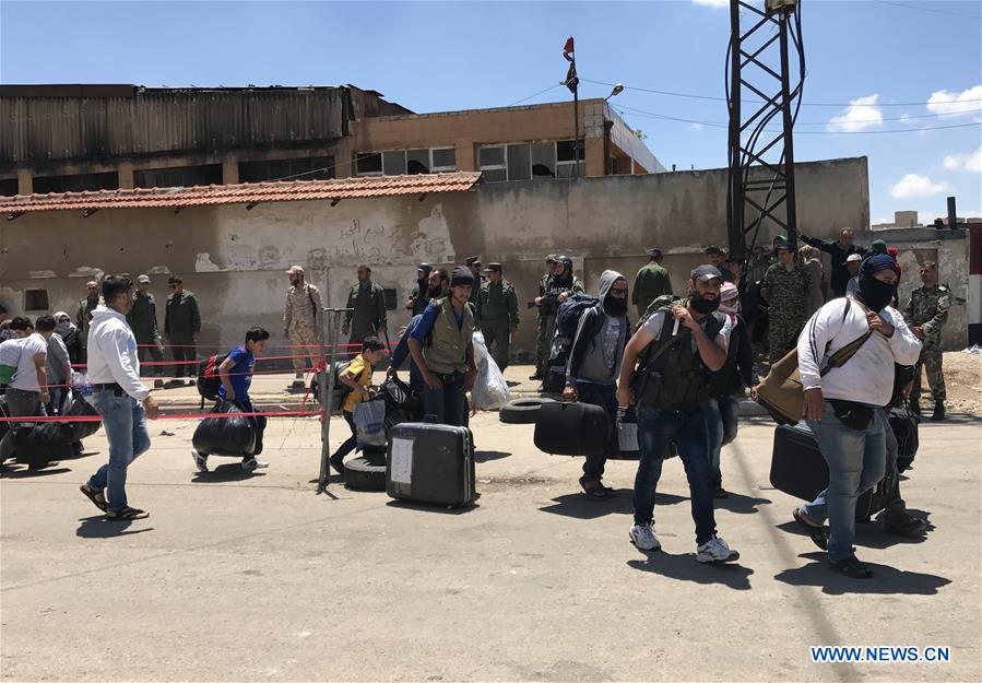 SYRIA-HOMS-REBELS-EVACUATION