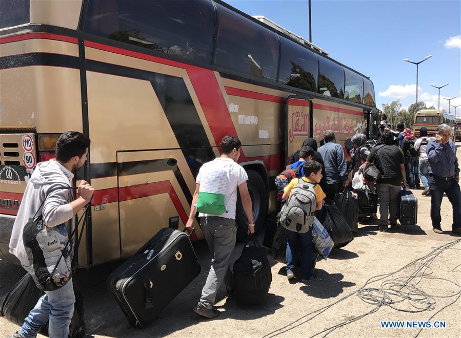 SYRIA-HOMS-REBELS-EVACUATION