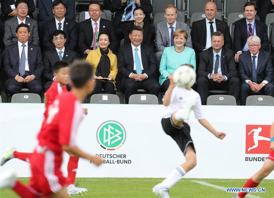 GERMANY-CHINA-XI JINPING-MERKEL-YOUTH FOOTBALL MATCH