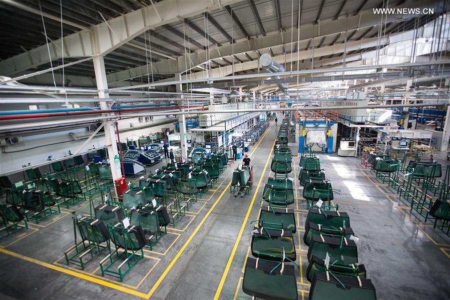 Workers busy at Russian factory of China's Fuyao Glass in Kaluga