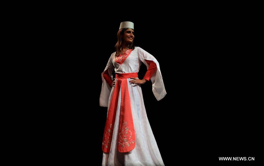 Models present traditional Armenian costumes in Jordan Xinhua
