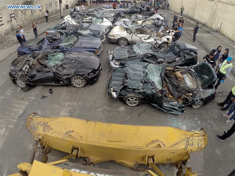 THE PHILIPPINES-MANILA-SMUGGLED LUXURY CARS-CRUSH