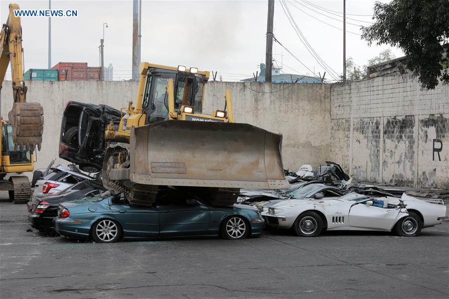 THE PHILIPPINES-MANILA-SMUGGLED LUXURY CARS-CRUSH