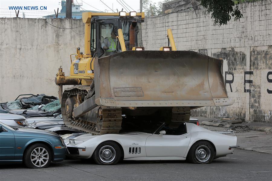THE PHILIPPINES-MANILA-SMUGGLED LUXURY CARS-CRUSH