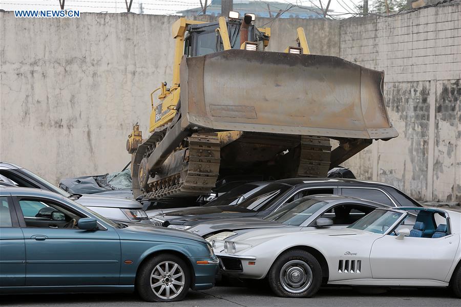 THE PHILIPPINES-MANILA-SMUGGLED LUXURY CARS-CRUSH