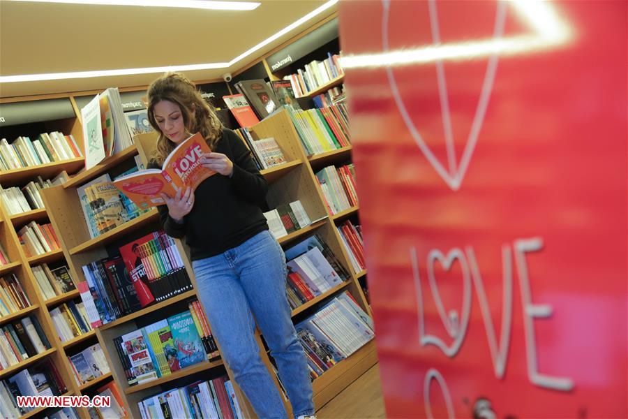GREECE-ATHENS-KIFISSIA-VALENTINE'S DAY-EXCHANGING BOOKS