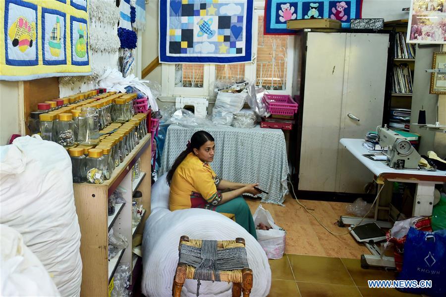 EGYPT-CAIRO-APE-WOMEN-GARBAGE-RECYCLING-PRODUCTS