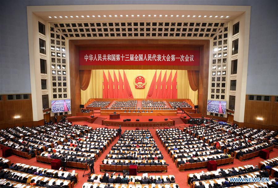 China's national legislature hears draft supervision law, cabinet reshuffle plan