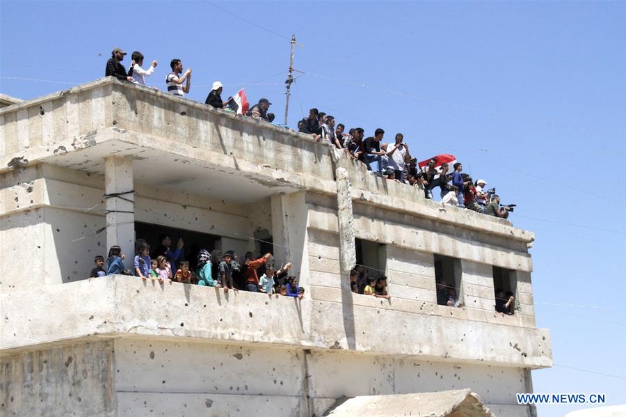 SYRIA-HOMS-REBELS-EVACUATION