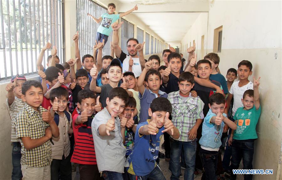 SYRIA-DAMASCUS-CHILDREN-RETURN-TO-SCHOOL