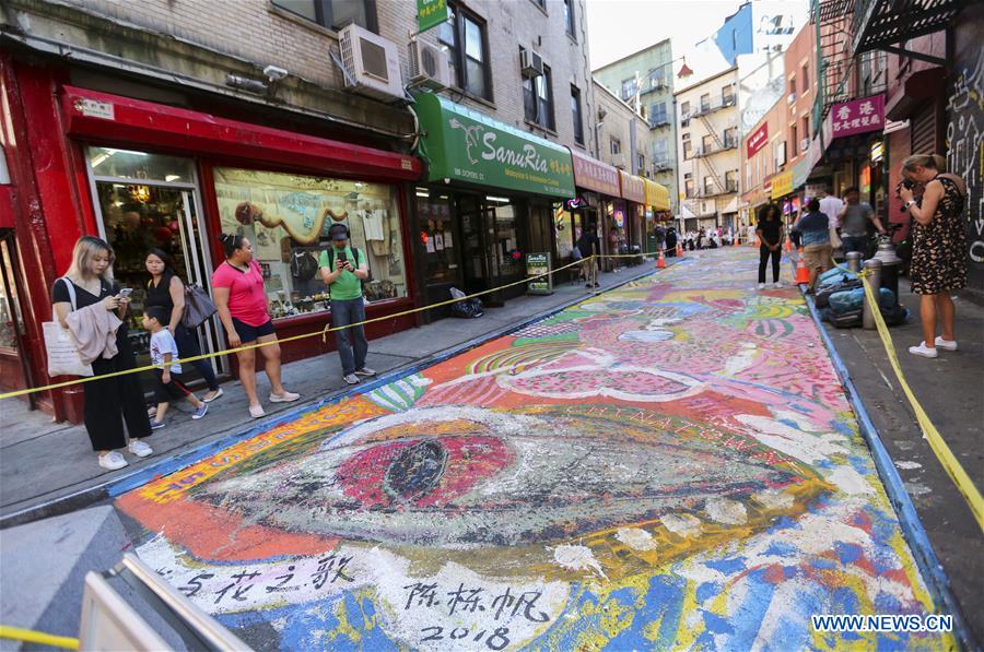 Historic street in NYC's Chinatown being painted into giant mural