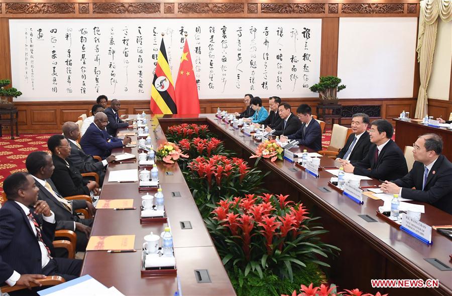 CHINA-BEIJING-WANG YANG-UGANDAN PRESIDENT-MEETING (CN)