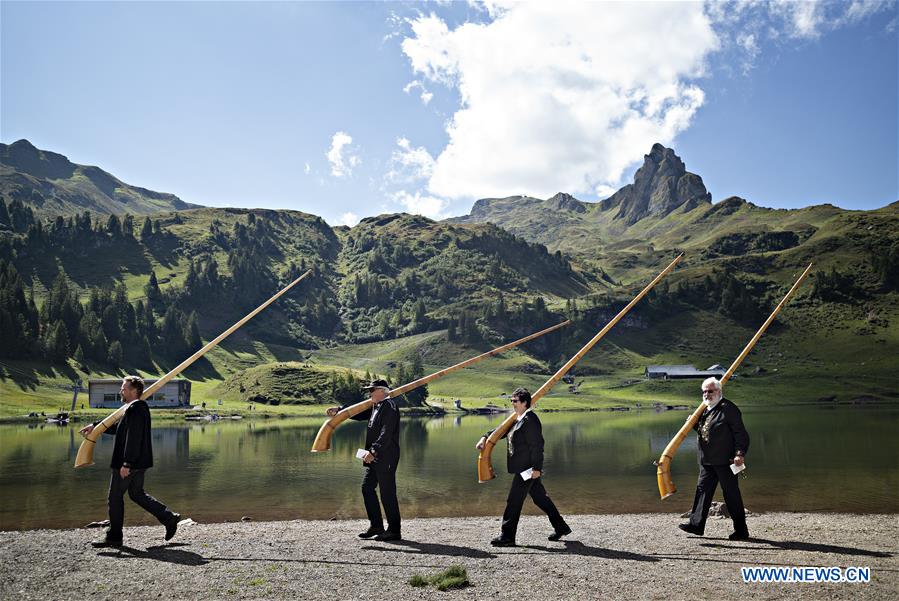SWITZERLAND-SEEBENALP-SWISS ALPINE HORNS-PLAYING