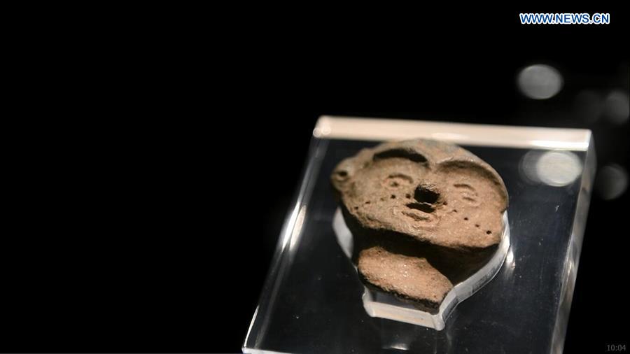 Xinhua Headlines: Mysterious female pottery face sends 7,300 year-old smile