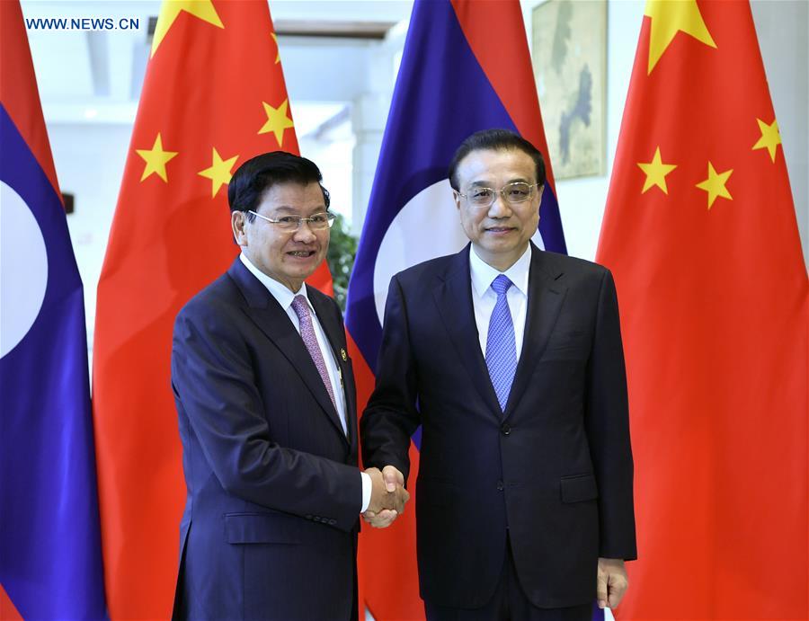 Chinese Premier Li Keqiang (R) meets with Lao Prime Minister Thongloun Sisoulith, who is attending the Boao Forum for Asia annual conference, in Boao, south China's Hainan Province, March 27, 2019. Image: Xinhua/Yin Bogu
