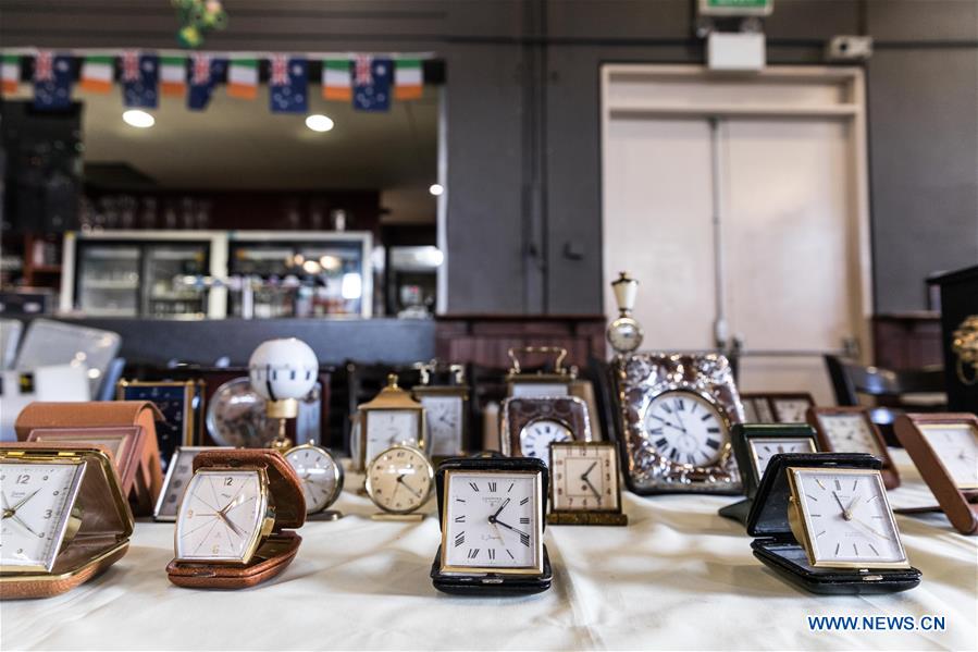 Horological exhibition show time, place via ticking of clocks in