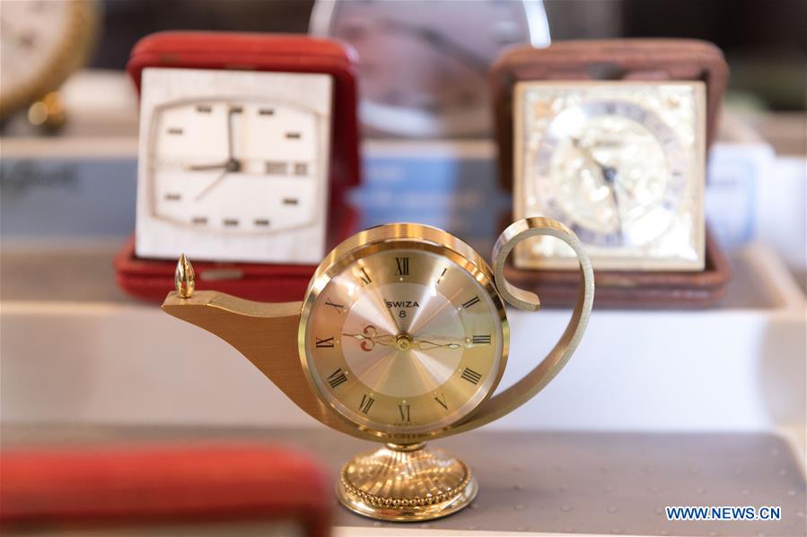 Horological exhibition show time, place via ticking of clocks in