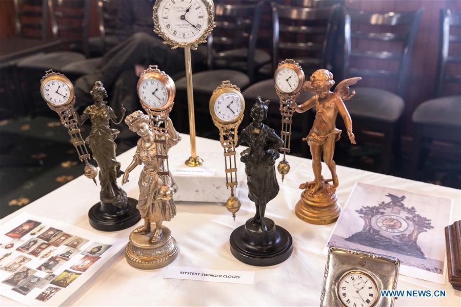 Horological exhibition show time, place via ticking of clocks in