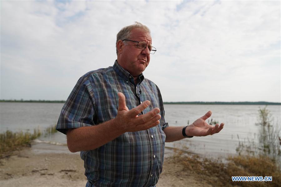 U.S.-FLOODS-MIDWEST FARMER-DISASTER-U.S.-CHINA TRADE TENSIONS