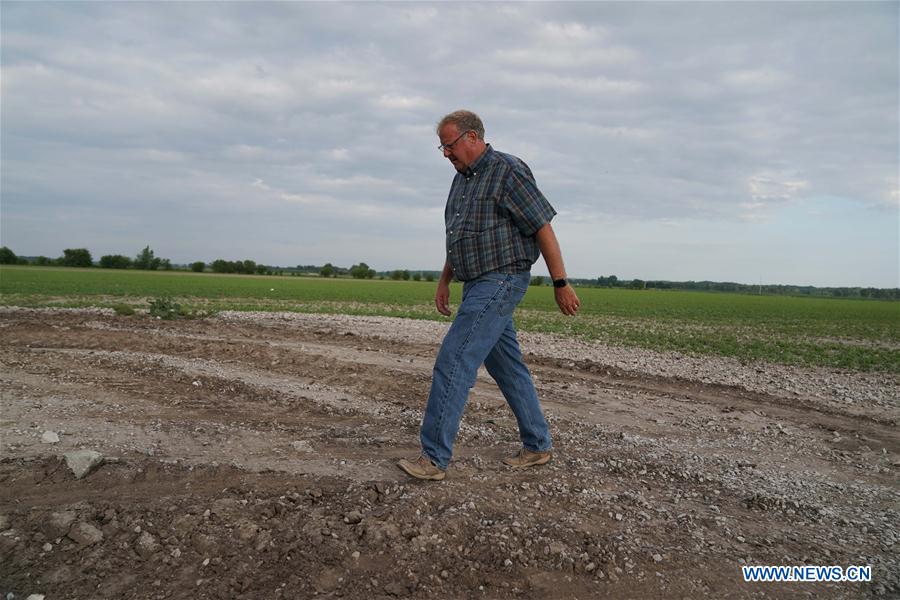 U.S.-FLOODS-MIDWEST FARMER-DISASTER-U.S.-CHINA TRADE TENSIONS